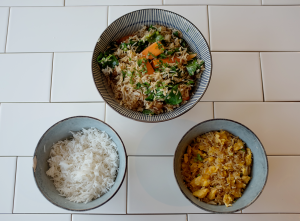 Three bowls of rice: plain rice, pork fried rice and egg fried rice