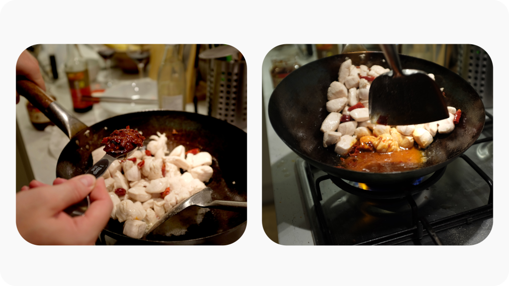 Adding chilli bean paste to a wok with chicken frying in it.