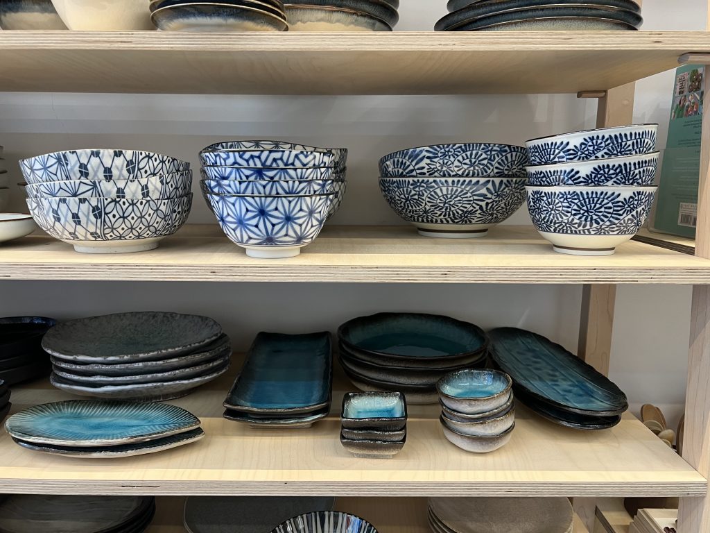 Some shelves filled with East Asian ceramics