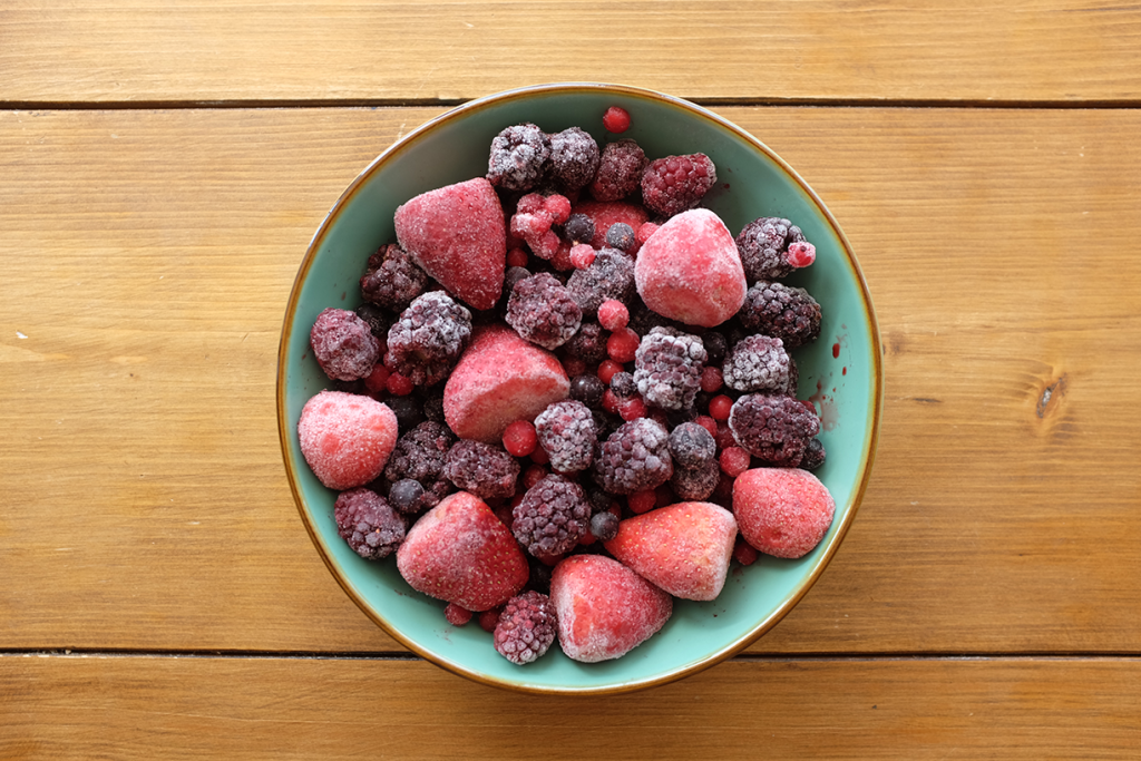 A bowl full of frozen berries.